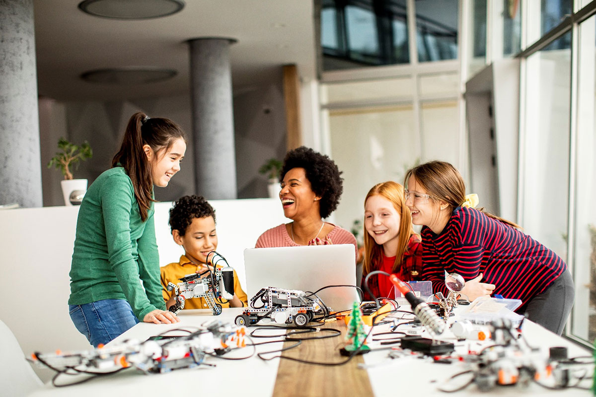 students at computer smiling